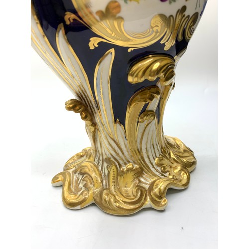 3 - A pair of H&R Daniel Baroque Vases glazed blue with gilded handles and laurels, slight hairline crac... 