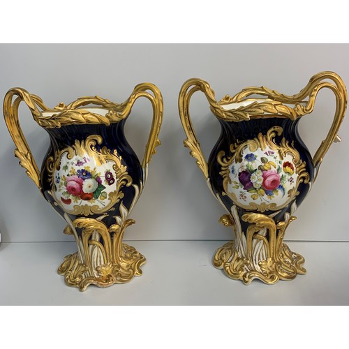 3 - A pair of H&R Daniel Baroque Vases glazed blue with gilded handles and laurels, slight hairline crac... 