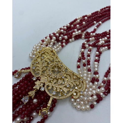 103 - An Elaborate Indian Necklace with Rubies (colour enhanced) natural Pearls and Cubic Zirconia.