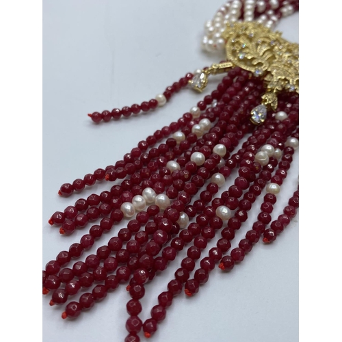 103 - An Elaborate Indian Necklace with Rubies (colour enhanced) natural Pearls and Cubic Zirconia.