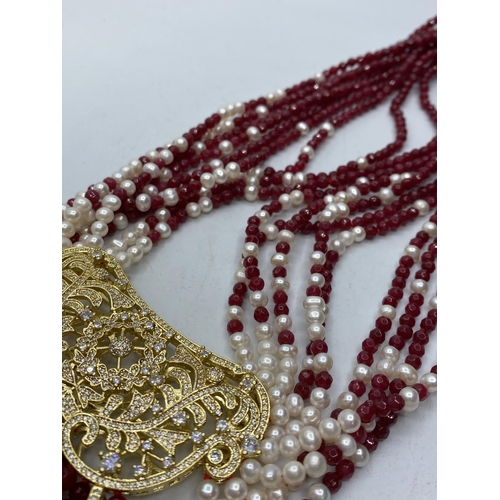 103 - An Elaborate Indian Necklace with Rubies (colour enhanced) natural Pearls and Cubic Zirconia.