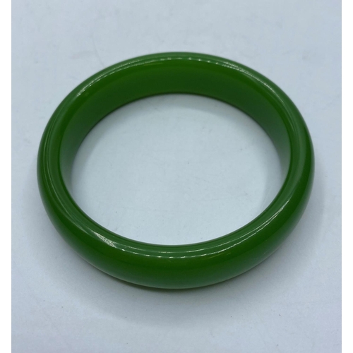 71 - A green Jade Bangle, internal diameter 63mm approx