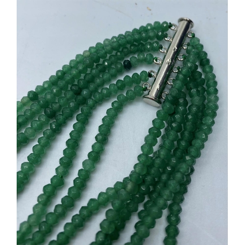 75 - A six row faceted Emerald bead Necklace with a marcasite attachment.