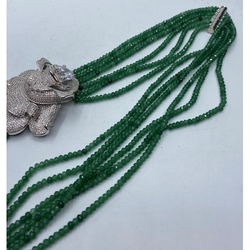 75 - A six row faceted Emerald bead Necklace with a marcasite attachment.