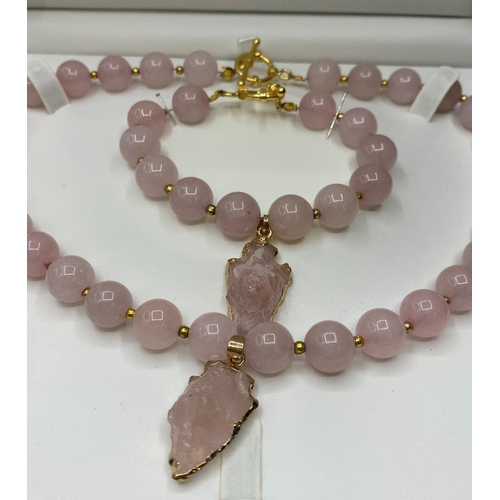 89 - A Necklace, Bracelet and Earrings set of Rose Quartz round Beads and arrow heads in a presentation b... 