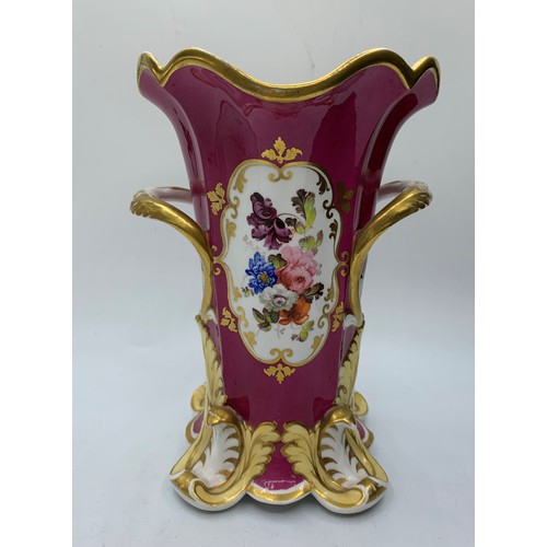 181 - H&R Daniel four footed maroon glaze Vase with floral theme, in good condition 18cm tall