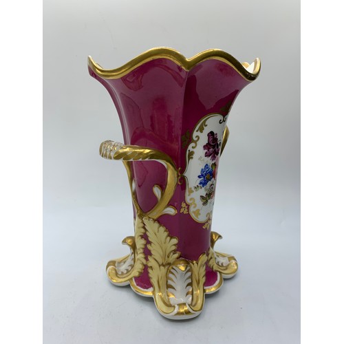 181 - H&R Daniel four footed maroon glaze Vase with floral theme, in good condition 18cm tall