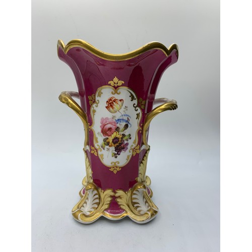 181 - H&R Daniel four footed maroon glaze Vase with floral theme, in good condition 18cm tall