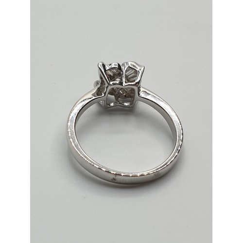 27 - 18ct White Gold Diamond Flower Ring with approx 0.38ct diamonds, weight 4.3g and size O