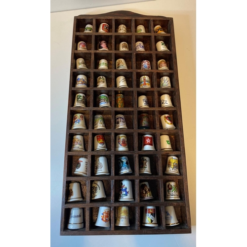 463 - Assortment of 50x Bone China Thimbles presented in a wooden display case, each thimble has a differe... 