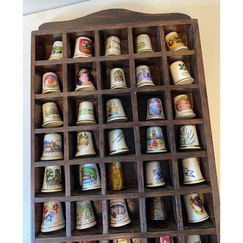 463 - Assortment of 50x Bone China Thimbles presented in a wooden display case, each thimble has a differe... 