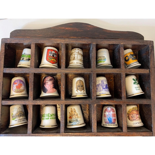 463 - Assortment of 50x Bone China Thimbles presented in a wooden display case, each thimble has a differe... 