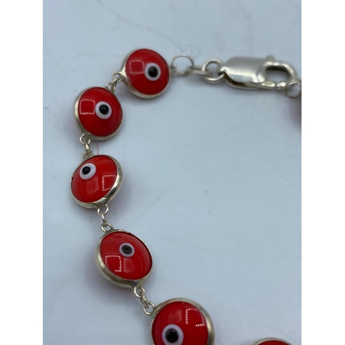 490 - Silver Mati Nazar Bracelet with Red Stones, 19cm long and marked 925