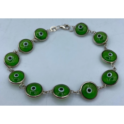 491 - Silver Mati Nazar Bracelet with green stones, traditionally worn to ward off the evil eye, marked Si... 