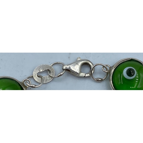 491 - Silver Mati Nazar Bracelet with green stones, traditionally worn to ward off the evil eye, marked Si... 