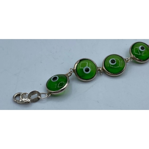 491 - Silver Mati Nazar Bracelet with green stones, traditionally worn to ward off the evil eye, marked Si... 