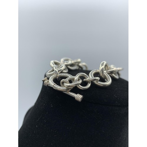 219 - Silver Bracelet with large oval and round links, having a T Bar clasp and hallmark showing on the T ... 