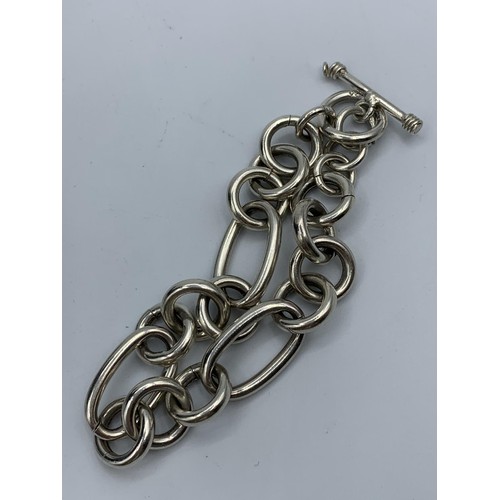 219 - Silver Bracelet with large oval and round links, having a T Bar clasp and hallmark showing on the T ... 