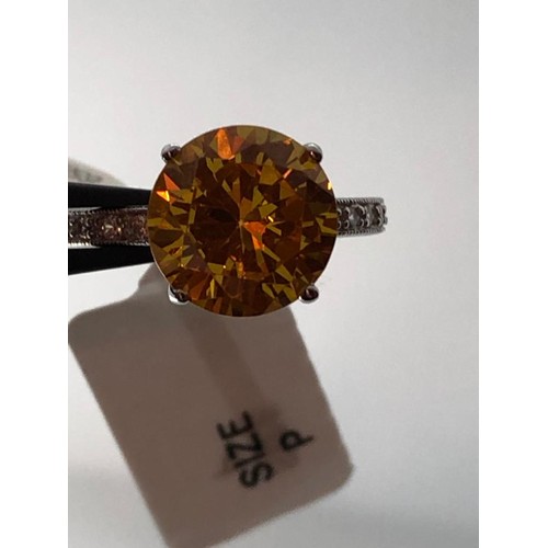 243 - Silver Claw set Ring with Amber CZ (over 11mm diameter stone), size P and weight 5.26g