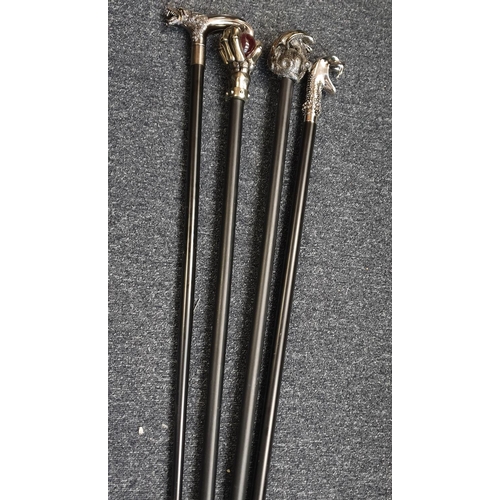 111 - Selection of 4x Gothic Walking Sticks with black sticks and unusual white metal handles (4)