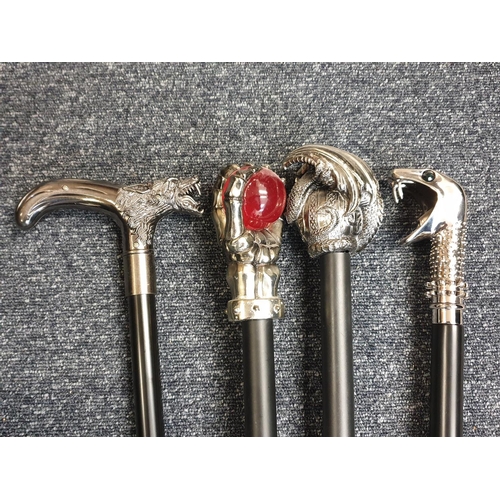 111 - Selection of 4x Gothic Walking Sticks with black sticks and unusual white metal handles (4)