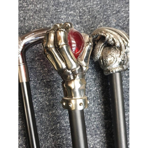 111 - Selection of 4x Gothic Walking Sticks with black sticks and unusual white metal handles (4)