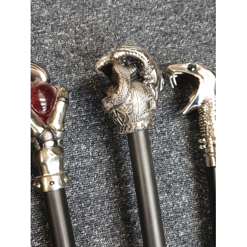 111 - Selection of 4x Gothic Walking Sticks with black sticks and unusual white metal handles (4)