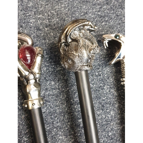 111 - Selection of 4x Gothic Walking Sticks with black sticks and unusual white metal handles (4)