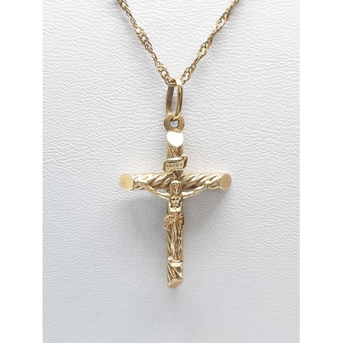 152 - 9ct Yellow Gold Crucifix on a 46cm long 9ct gold Necklace, weight 3.7g