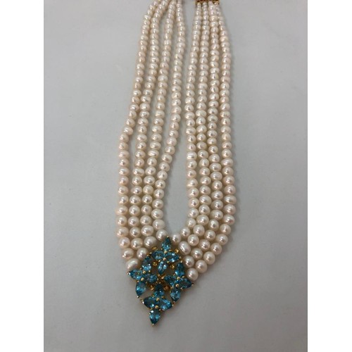 275 - 4 rows Necklace with Freshwater Pearls, Rubies and Topaz Clasp, 20