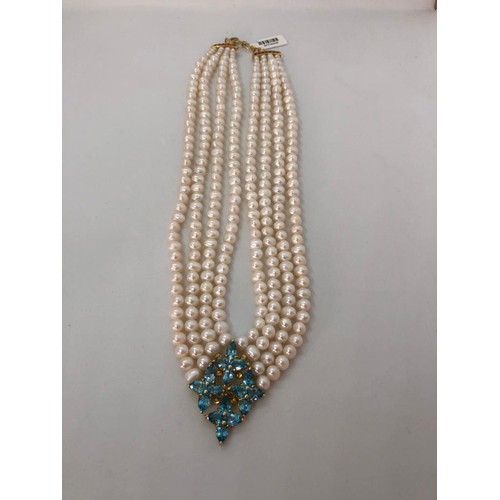 275 - 4 rows Necklace with Freshwater Pearls, Rubies and Topaz Clasp, 20