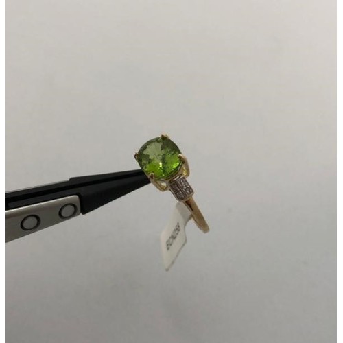 305 - 10K Yellow Gold Ring with 4.50ct Tsavorite centre and Diamonds shoulders, weight 2.48g and size P (E... 