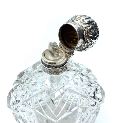 236 - Antique Silver topped cut glass Scent Bottle, having a clear hallmark for Birmingham 1893, hinged li... 