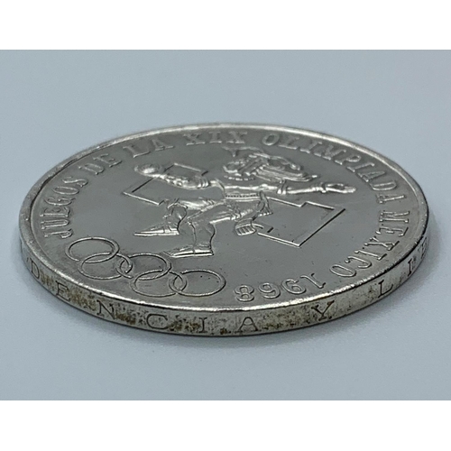 240 - Silver 25 Peso Coin from the Mexico Olympics 1968, uncirculated and good condition, still having cle... 