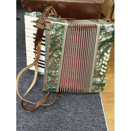 9 - A Vintage 'Rosetts' Accordian, Bellows in good working order but one key needs a new spring, comes i... 