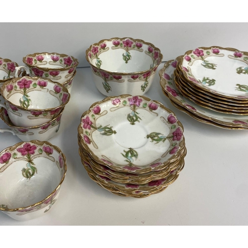 7 - A Chapman England Floral Bone China Tea set, comprising of 6 cups and saucers, 6 side plates and 2 s... 