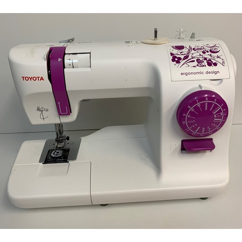 226 - Toyota Home Sewing Machine, ergonomic design with instruction booklet, 38x28cm approx