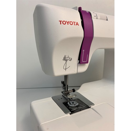 226 - Toyota Home Sewing Machine, ergonomic design with instruction booklet, 38x28cm approx