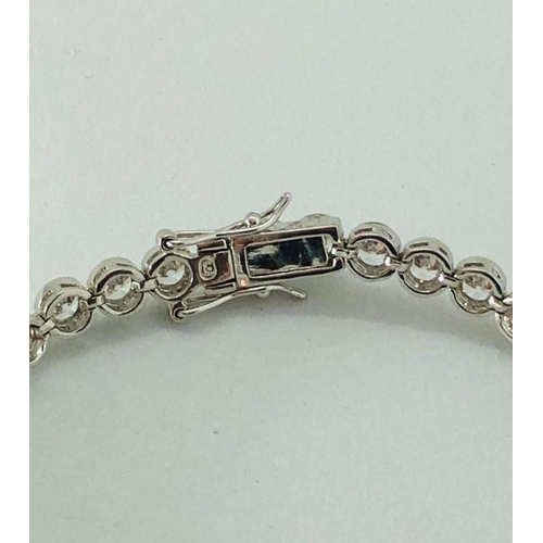 335 - Sterling Silver Bracelet with CZ stones, weight 15.3g and 7.5