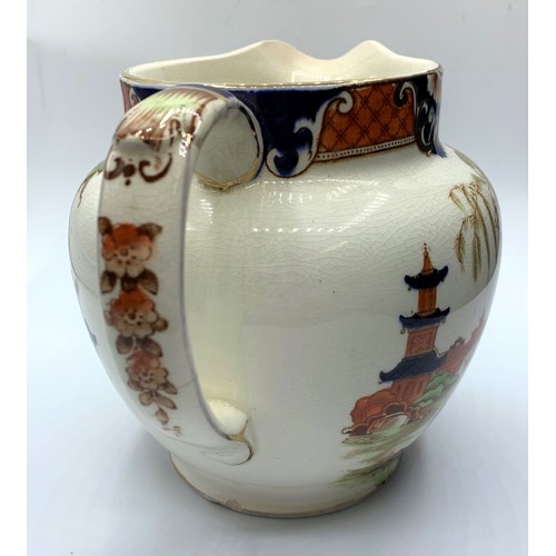 256 - Nice example of a Burma Oriental themed Jug with cracked glazed finish (repair on handle), 14cm tall