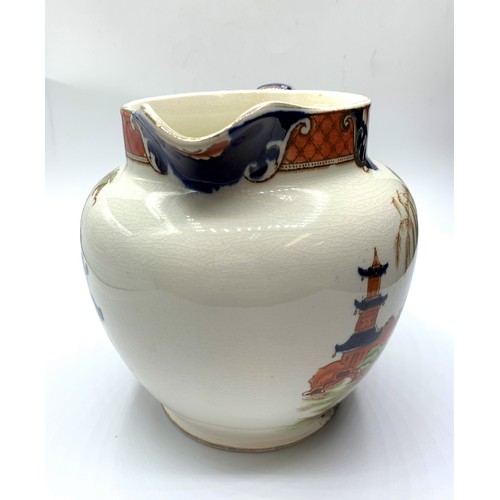 256 - Nice example of a Burma Oriental themed Jug with cracked glazed finish (repair on handle), 14cm tall