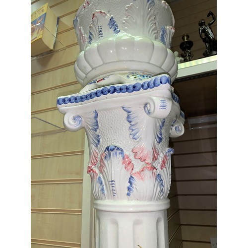 280 - A Porcelain Jardiniere on a classic column plynth in white with floral decoration