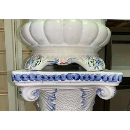 280 - A Porcelain Jardiniere on a classic column plynth in white with floral decoration