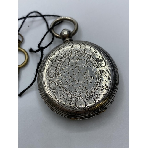 213 - Silver open faced Ladies Pocket Watch circa 1890, having floral design chase work to case which  ope... 