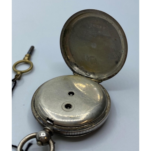 213 - Silver open faced Ladies Pocket Watch circa 1890, having floral design chase work to case which  ope... 