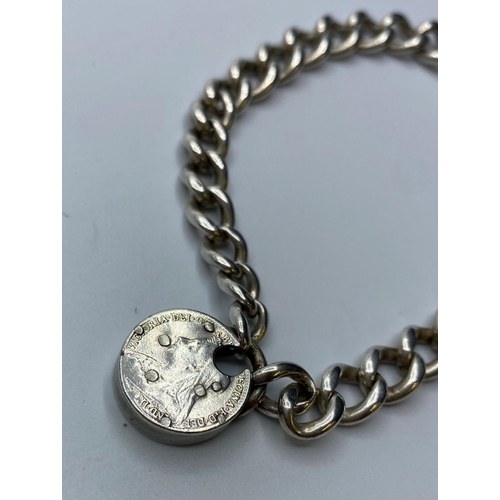 437 - Vintage Silver Bracelet with silver coin padlock, weight 27g and 21cm long approx