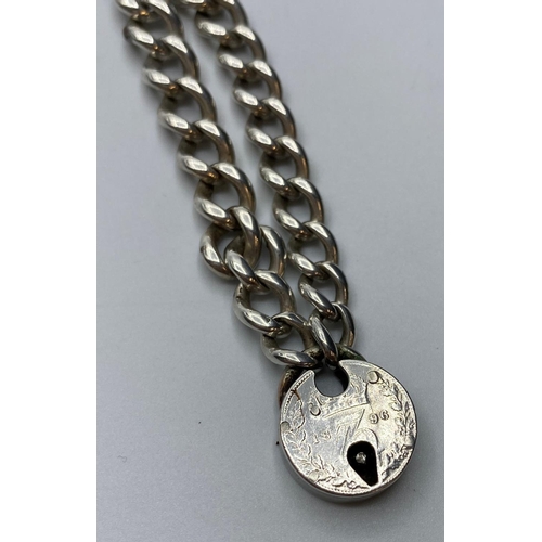 437 - Vintage Silver Bracelet with silver coin padlock, weight 27g and 21cm long approx