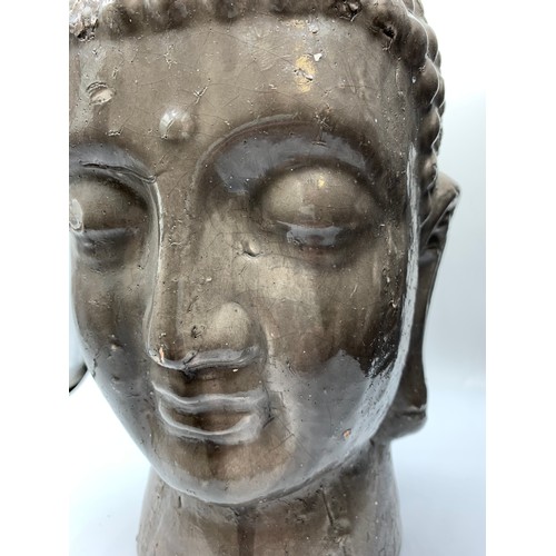 438 - A large earthenware Buddha Head with some damage, made for the PTMD Collection, Holland