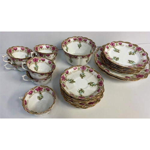 200 - A Chapman England Floral Bone China Tea set, comprising of 11 cups and saucers, 12 side plates and 2... 