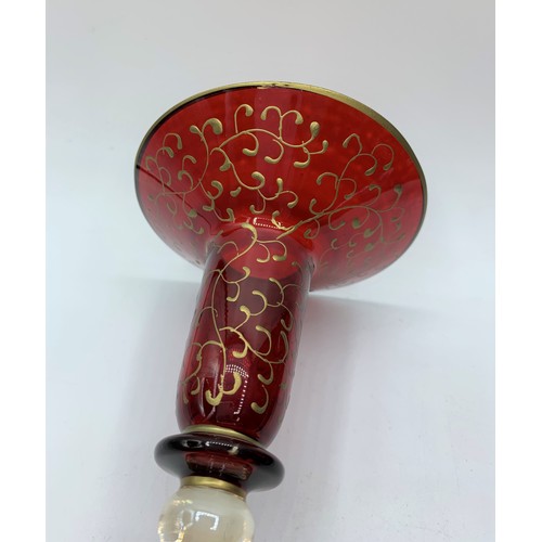 146 - A pair of Blown Cranberry Glass Candlesticks with glass and gold stems, 25cm tall (2)